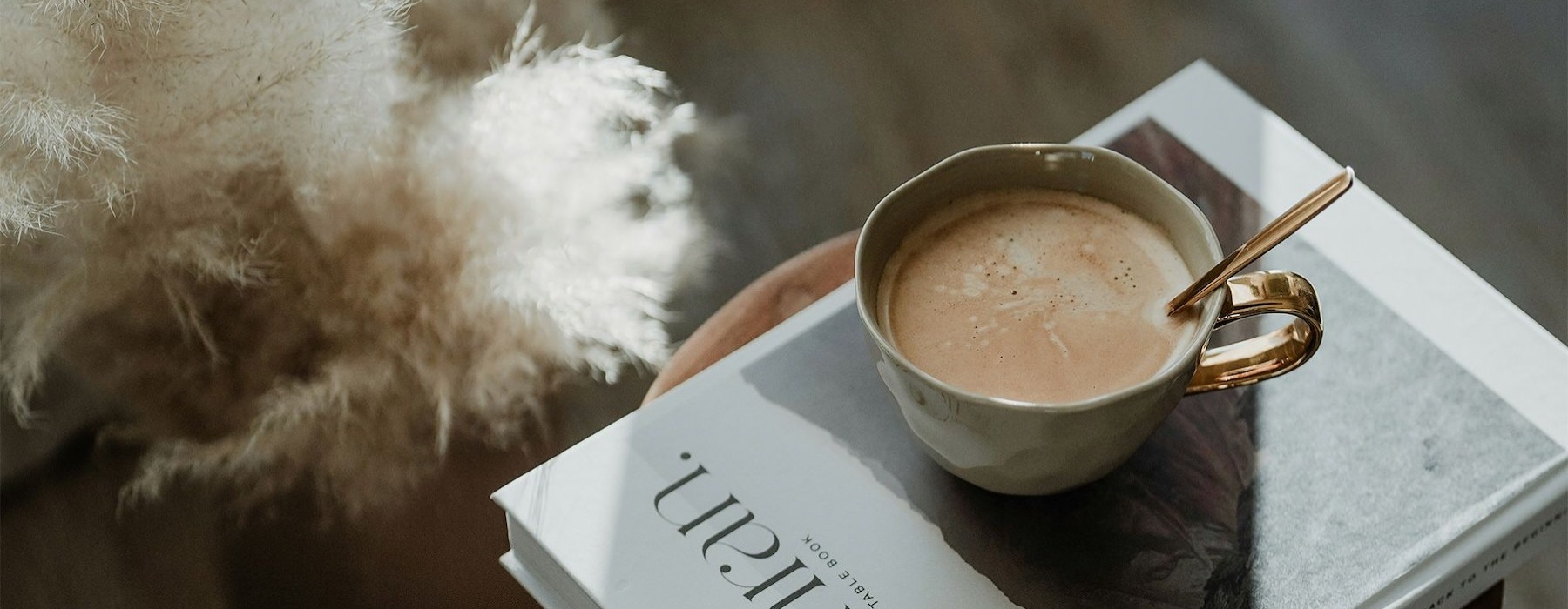 a cup of coffee on a book